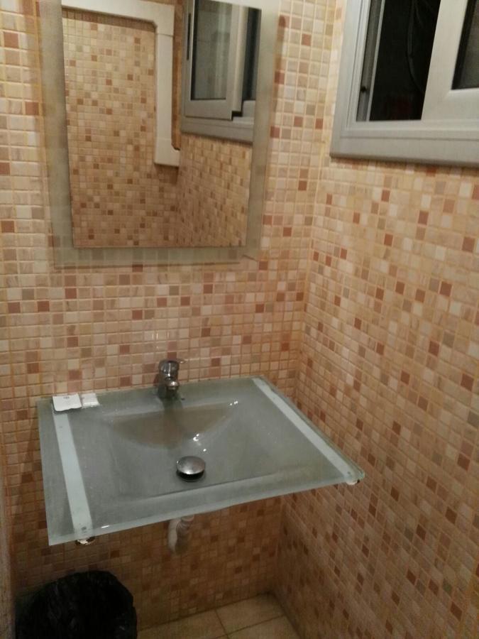 Basic Single Room with Shared Bathroom
